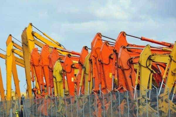 A colorful display of construction equipment at a rental company