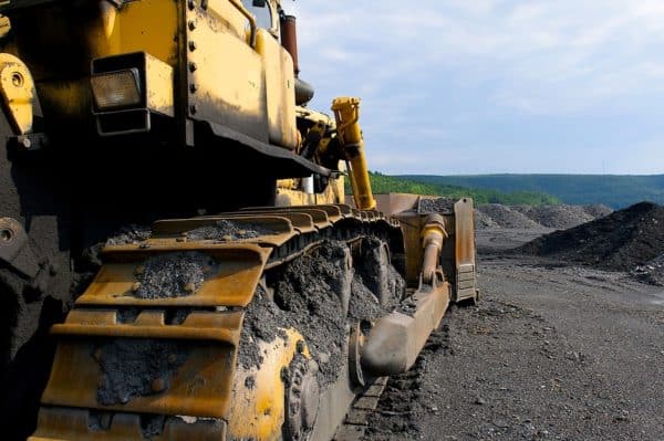 Industrial image of construction equipment. Bull-dozer shown at a coal mine.